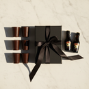 Baileys and dark chocolate shot glass gift set on white marble surface