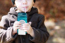 Juicy Drink Box with child at picnic drinking - Bundled Gifts